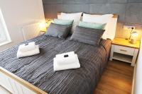 Posteľ alebo postele v izbe v ubytovaní Aqua Apartments Sunset