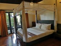 Postel nebo postele na pokoji v ubytování Kao Tao Villa Beach Resort-Hua Hin
