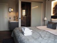 Postel nebo postele na pokoji v ubytování Ascot Hotel