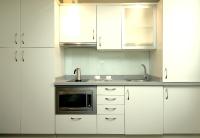 A kitchen or kitchenette at Classbedroom Born Apartments