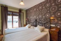Cama o camas de una habitación en Hostal El Escudo de Mijas