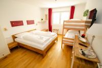 Łóżko lub łóżka w pokoju w obiekcie Finest Kitzblick Golf Suites by All in One Apartments