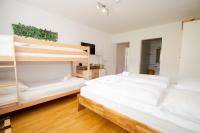 Łóżko lub łóżka w pokoju w obiekcie Finest Kitzblick Golf Suites by All in One Apartments