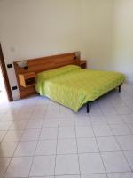 A bed or beds in a room at Bed and Breakfast "POGGIO MARANO"