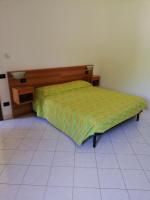 A bed or beds in a room at Bed and Breakfast "POGGIO MARANO"