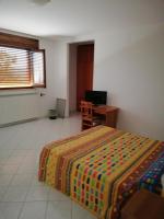 A bed or beds in a room at Bed and Breakfast "POGGIO MARANO"