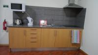 Kuchyň nebo kuchyňský kout v ubytování Lindo Apartamento Villa