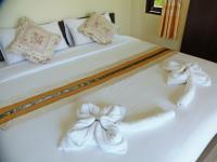Postel nebo postele na pokoji v ubytování Pai My Guest Resort - SHA Plus