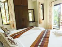 Postel nebo postele na pokoji v ubytování Pai My Guest Resort - SHA Plus