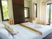 Postel nebo postele na pokoji v ubytování Pai My Guest Resort - SHA Plus