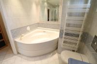 a bathroom with a tub and a toilet and a sink at 2, 3 and 4 bedroom sea view Forville Apartments 5 mins from the Palais in Cannes