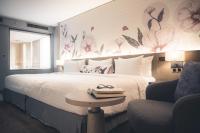 Postel nebo postele na pokoji v ubytování Sivatel Bangkok Hotel