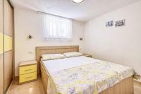 Posteľ alebo postele v izbe v ubytovaní Apartments Gracija