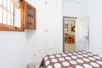 Łóżko lub łóżka w pokoju w obiekcie Casa Basallote
