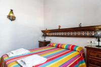 A bed or beds in a room at Cortijo Villa La Dehesa