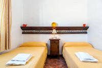 A bed or beds in a room at Cortijo Villa La Dehesa