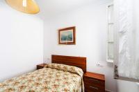 A bed or beds in a room at Luminoso apartamento en Cadiz