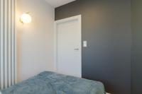 Posteľ alebo postele v izbe v ubytovaní Apartament Różana