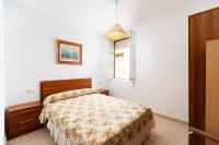 A bed or beds in a room at Luminoso apartamento en Cadiz