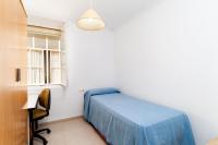 A bed or beds in a room at Luminoso apartamento en Cadiz