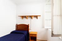 A bed or beds in a room at Luminoso apartamento en Cadiz