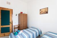 Posteľ alebo postele v izbe v ubytovaní Villa Rita