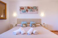 A bed or beds in a room at Casa Cristina Ibiza