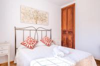 A bed or beds in a room at Casa Cristina Ibiza