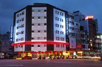 a building on a city street at night at Ai Lai Fashion Hotel in Taichung