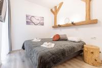 Łóżko lub łóżka w pokoju w obiekcie Apartamenty Granitica Zakopane