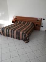 A bed or beds in a room at Bed and Breakfast "POGGIO MARANO"