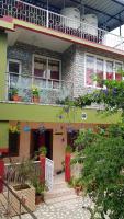 a building with a bunch of potted plants on it at Abhi&#39;s homestay in Port Blair