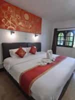Postel nebo postele na pokoji v ubytování The Krabi Forest Homestay