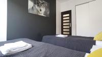 Posteľ alebo postele v izbe v ubytovaní Apartament Akali Centrum -Parking