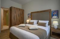 A bed or beds in a room at Minaret Suites and Apartments