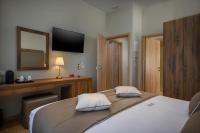 A bed or beds in a room at Minaret Suites and Apartments