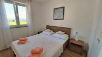 Postel nebo postele na pokoji v ubytování Apartment Ribnjak 10