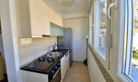 Kuchyň nebo kuchyňský kout v ubytování Apartment Ribnjak 10