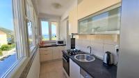 Kuchyň nebo kuchyňský kout v ubytování Apartment Ribnjak 10