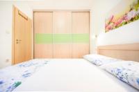 Posteľ alebo postele v izbe v ubytovaní Apartments Gracija