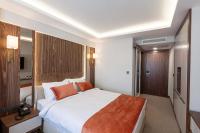 Postel nebo postele na pokoji v ubytování Sherry Suites Karaköy