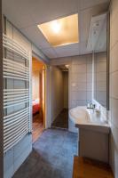 a bathroom with a sink and a bath tub at Les Sorbiers in Montricher-le-Bochet