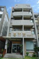 a building with chinese writing on the front of it at Hualien Sheraton Hostel in Hualien City