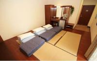 a room with two beds sitting on the floor at Hualien Sheraton Hostel in Hualien City