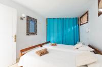 Postel nebo postele na pokoji v ubytování Villa Taguluche Famara