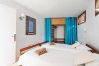 Postel nebo postele na pokoji v ubytování Villa Taguluche Famara