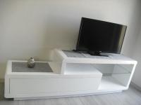 a white entertainment center with a tv on top of it at Apartments &quot;Am Nationalpark&quot; in Schwedt