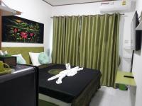 Postel nebo postele na pokoji v ubytování B&B NAMO PHUKET