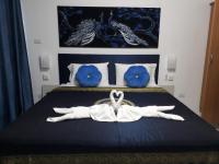 Postel nebo postele na pokoji v ubytování B&B NAMO PHUKET