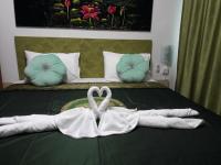 Postel nebo postele na pokoji v ubytování B&B NAMO PHUKET